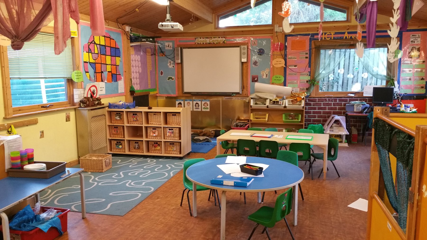 Pre-school classroom with book corner and ICT area