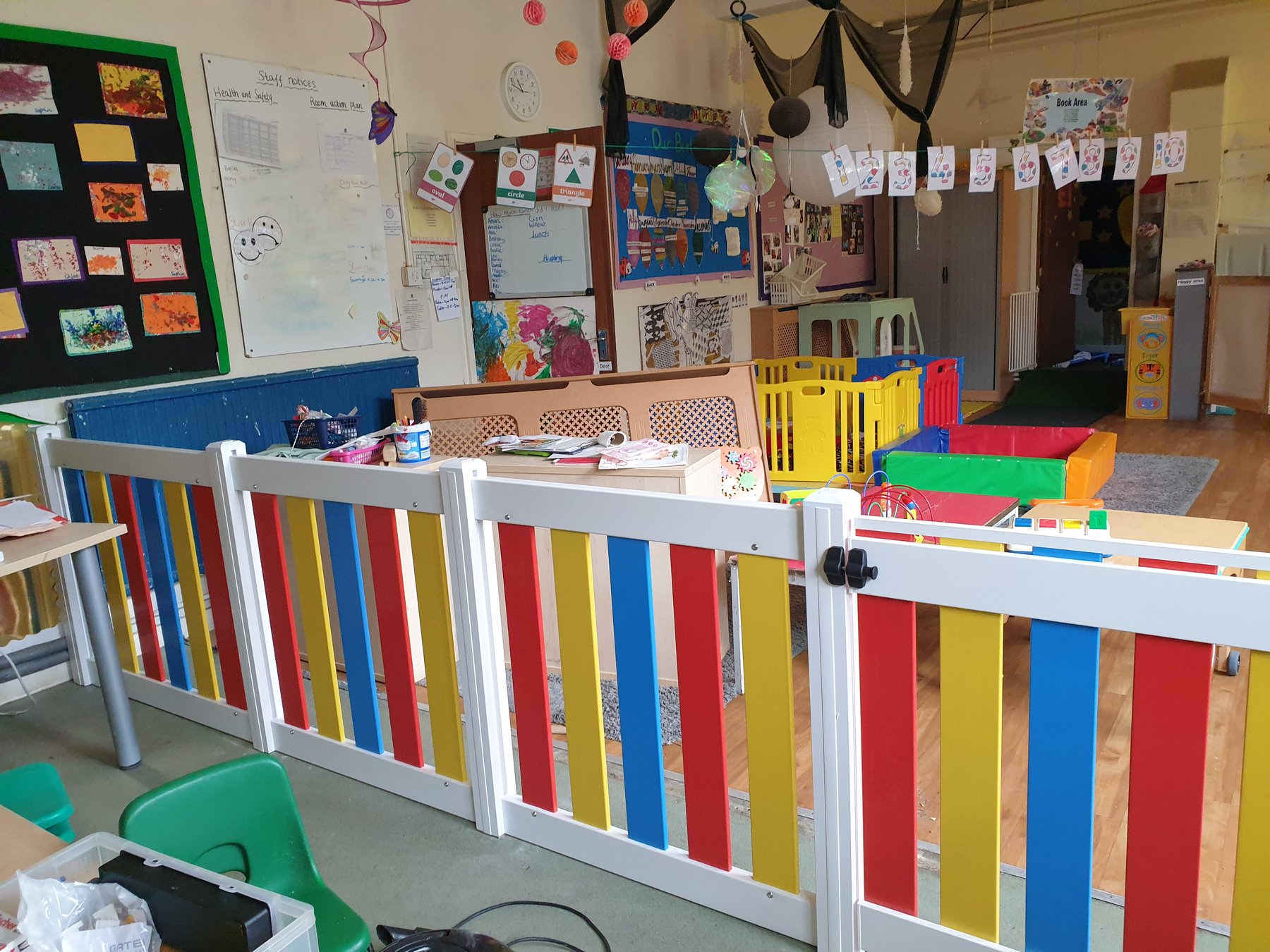 Toddler room activity area with safety gate
